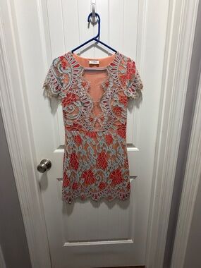 Storia Coral Lined Dress with Light Blue Lace Overlay.